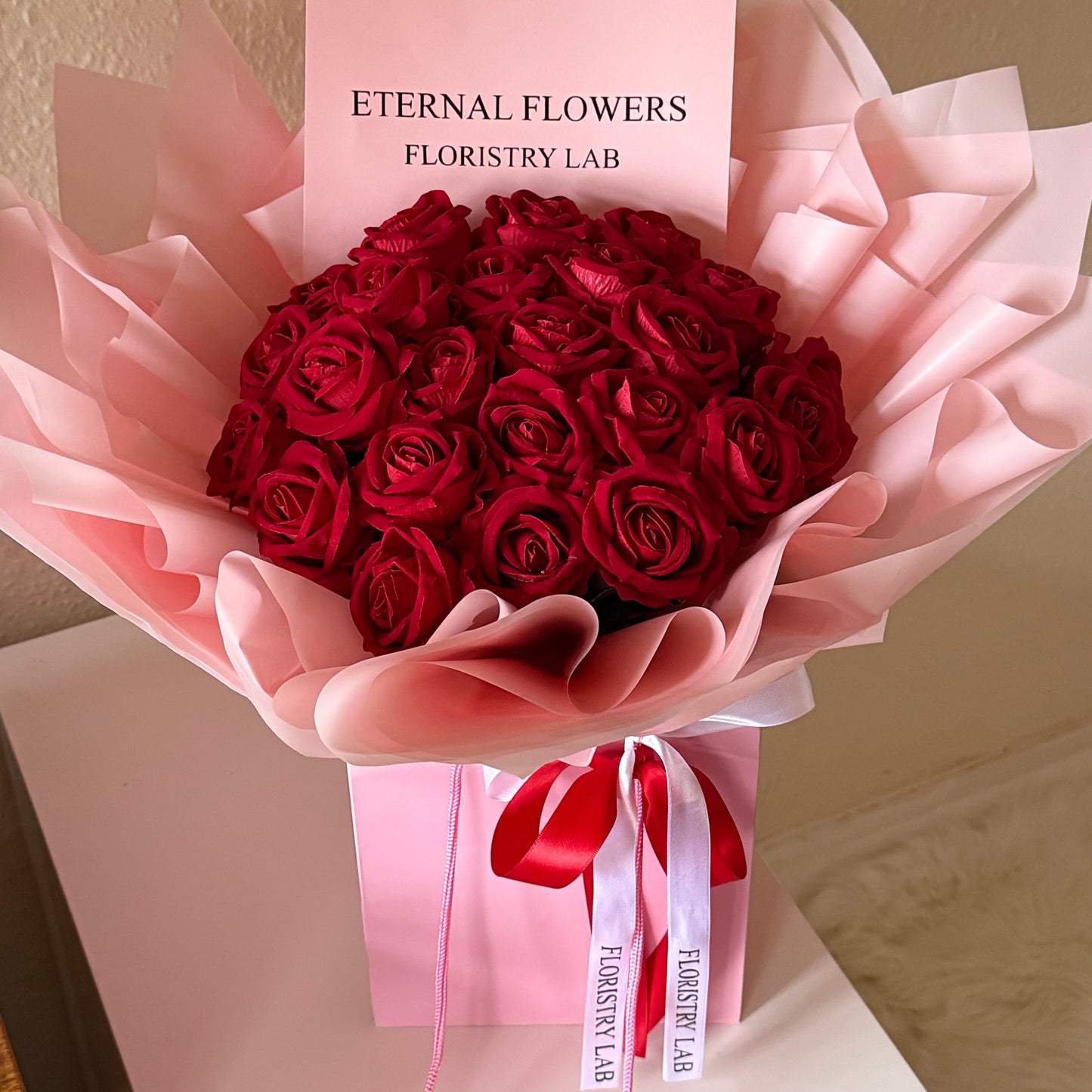 24 Red Eternal Roses - Pink Wrap