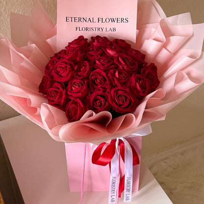 24 Red Eternal Roses - Pink Wrap